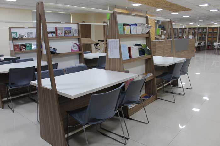 Library study area with comfortable seating and tables